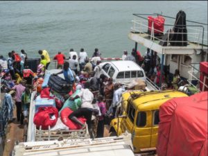 Residents of Senegal onboarding a ferry